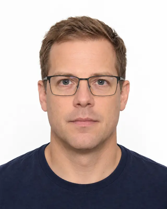 The same person wearing prescription eyeglasses.